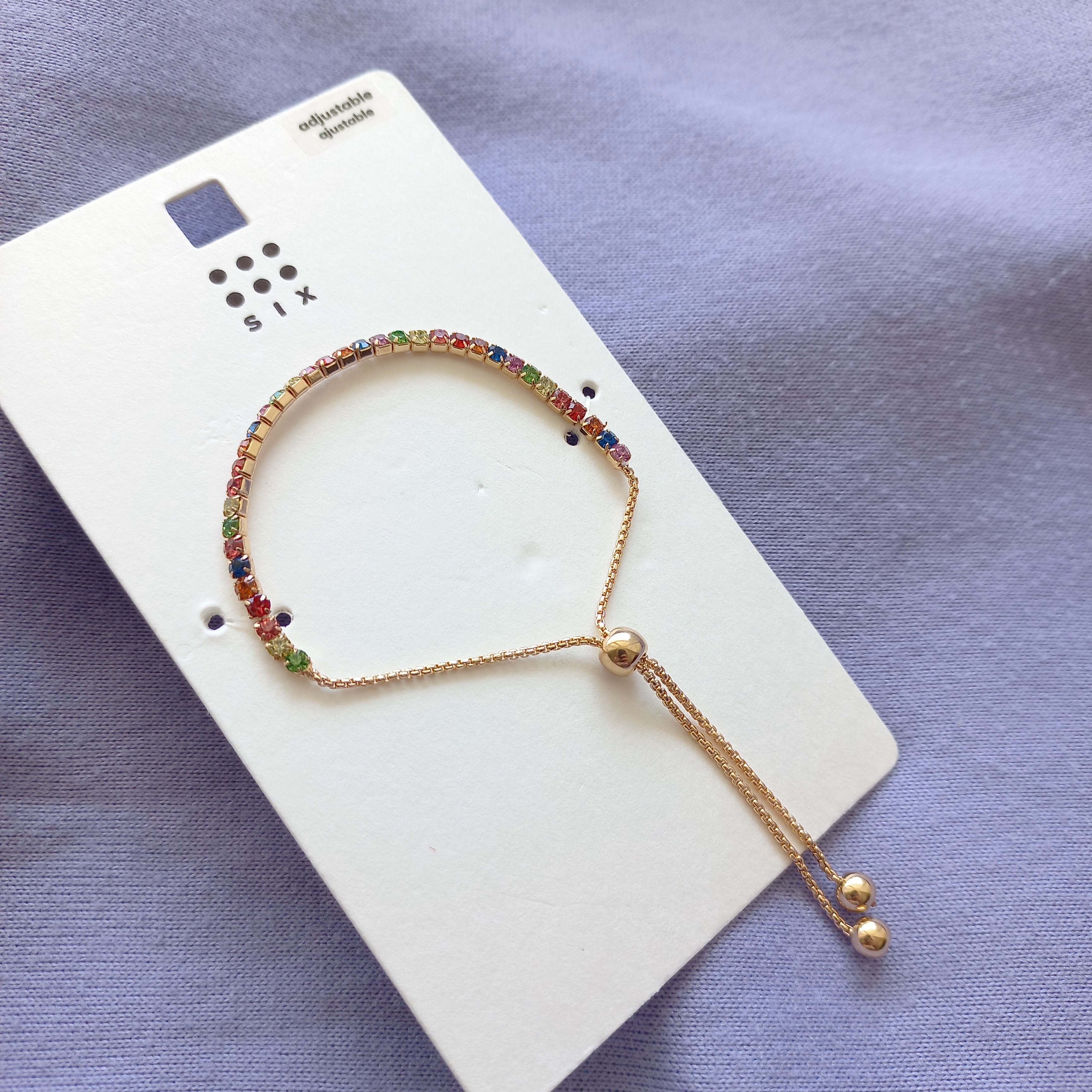 دستبند زنانه کراواتی نگین مولتی کالر طلایی برند اروپایی six ضدحساسیت